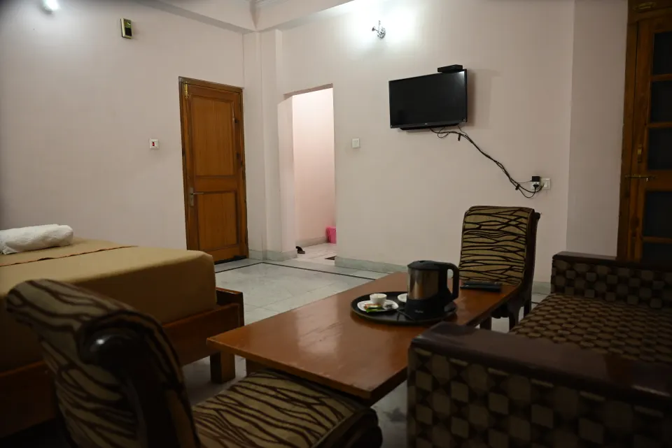 Executive Room with sitting area, tea table and wall-mounted TV