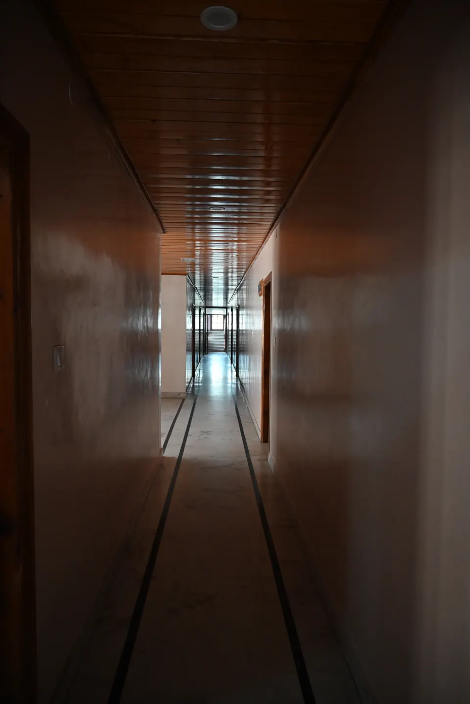 Hotel corridor with wooden panelling